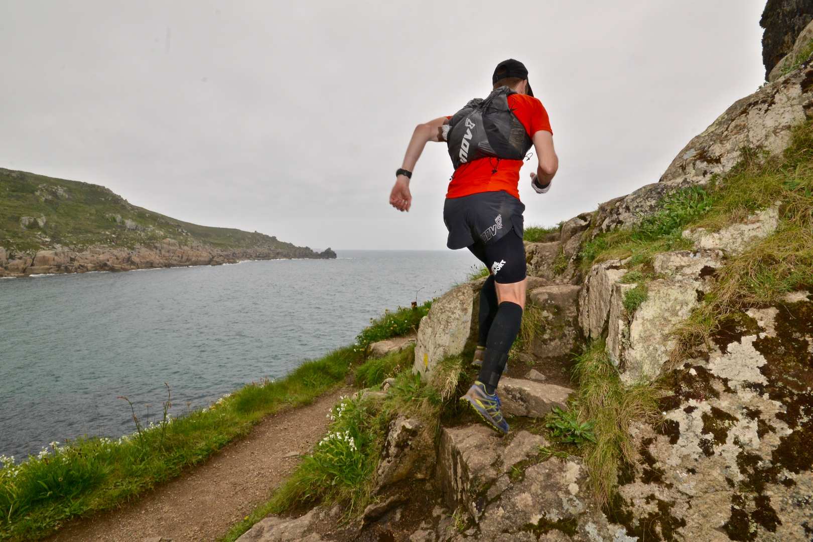 Trail running up rocky steps with the correct kit