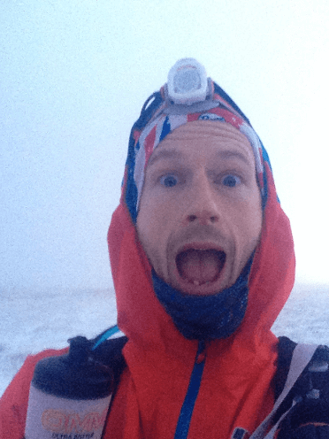Damian Hall whoops as he runs the Spine Race in deep snow.