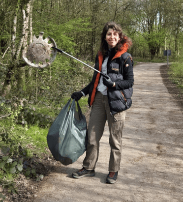 A Contours team member holds up a broken plastic hub cap found in the countryside near Carsington Water.