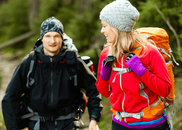 Two trail runners utilise layers of walking clothing to keep themselves warm and dry.