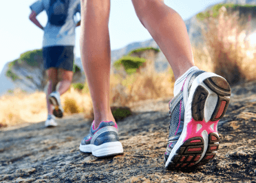 A runner protects herself against injury by wearing supportive running shoes.