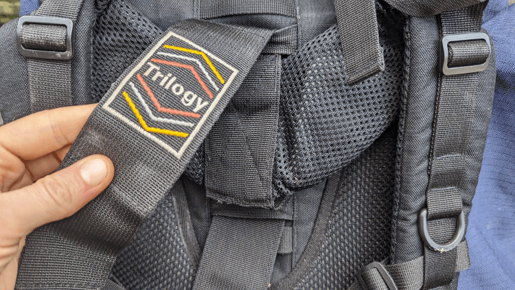 An adjustment strap on the back of a high-capacity rucksack. This allows a hiker to tailor the fit to the length of their back.