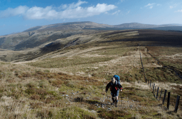 Damian Hall hikes over a wide expanse of moorland on the Pennine Way.