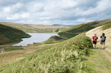 The Pennine Way winds through the Peak District alongside a lake.